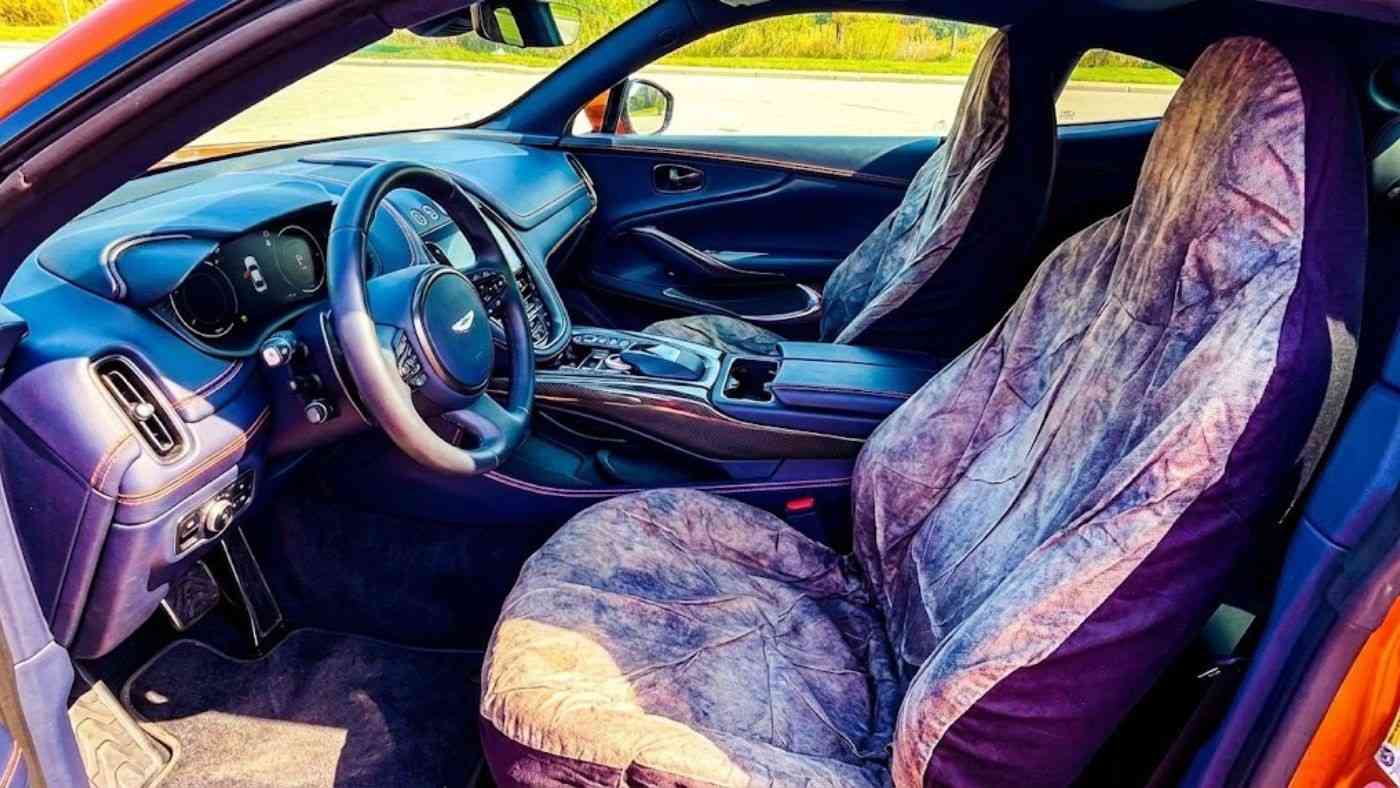 Universal fit seat covers that don’t slide or wrinkle installed on car seats showing snug fit and reduced bunching.