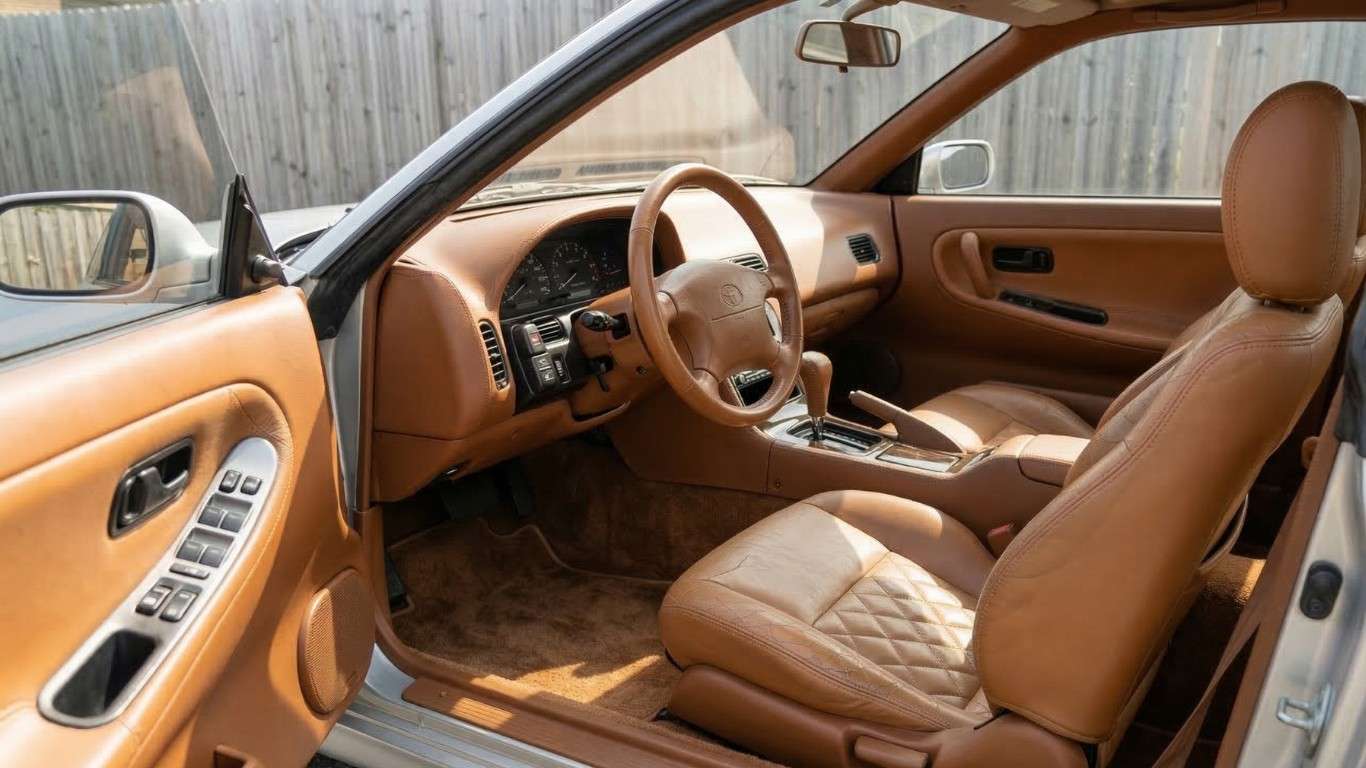 Car interior with leather seats illustrates material durability where durable seat covers for commuters reduce daily wear.