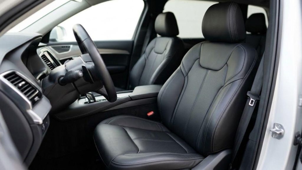 Vehicle interior with snug custom-fit seat covers; shows precise fit & durability benefits compared to no-budget seat covers.
