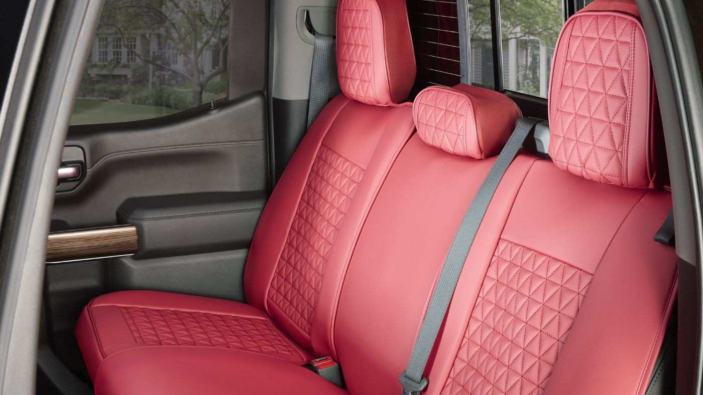 Custom-fitted rear seat cover with quilted design on car back seat showing full coverage protection and clean interior look.