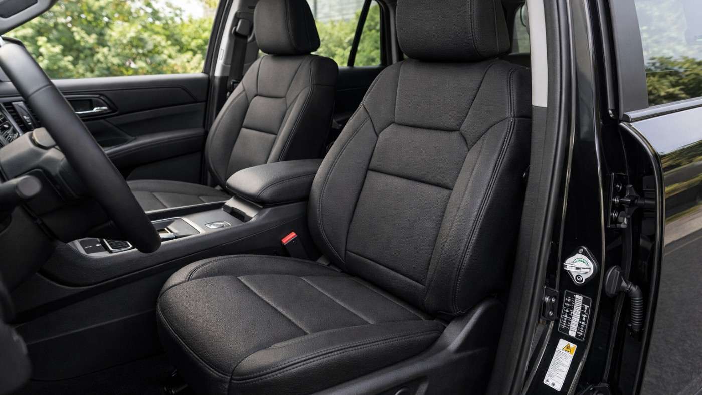 Close view of front car seats with full coverage seat covers highlighting durability, comfort, and protection for daily use.