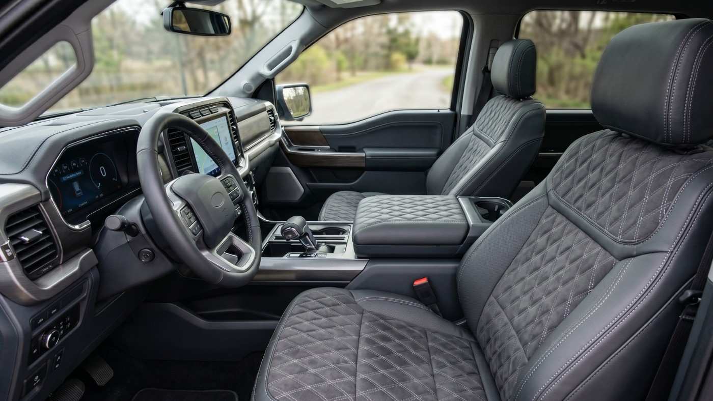 Ford F-150 STX interior with quilted custom seat covers, modern dashboard, and spacious truck cabin upgrade clean look.