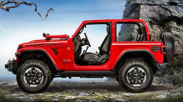 Jeep Wrangler with fold-down windshield feature demonstrated, showcasing open-air versatility