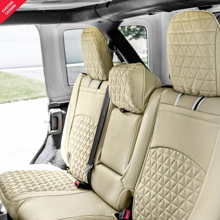 Luxury beige seat covers on back seat, passenger perspective