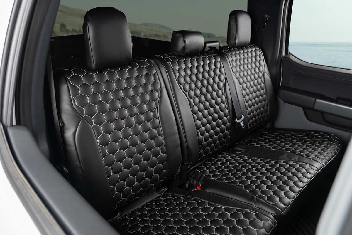 Ford F-150 King Ranch SuperCrew rear seats with hex-pattern covers built for ranch work and family mess daily use.