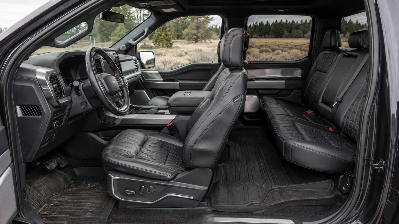 Ford F-150 Platinum SuperCrew rear seat area after two years, highlighting family use and preserved leather condition.