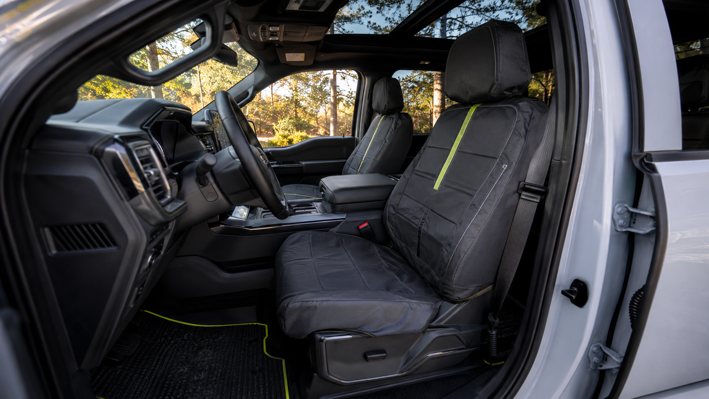 Ford F-150 Lightning Flash front seats with fitted covers showing practical EV cabin protection for daily use needs.
