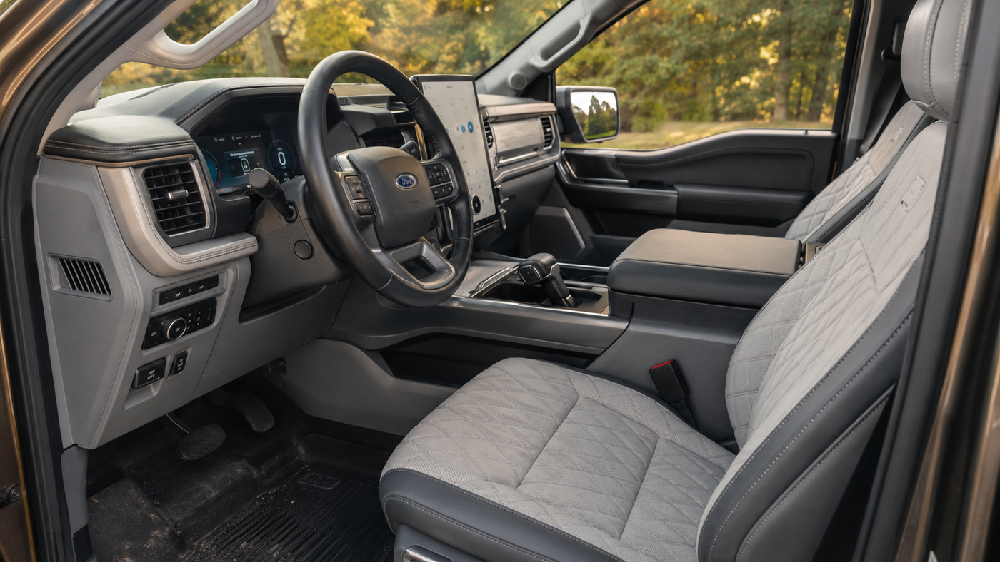 Ford F-150 Lightning Lariat interior showing premium front seats and console where owners often notice early wear after one year.