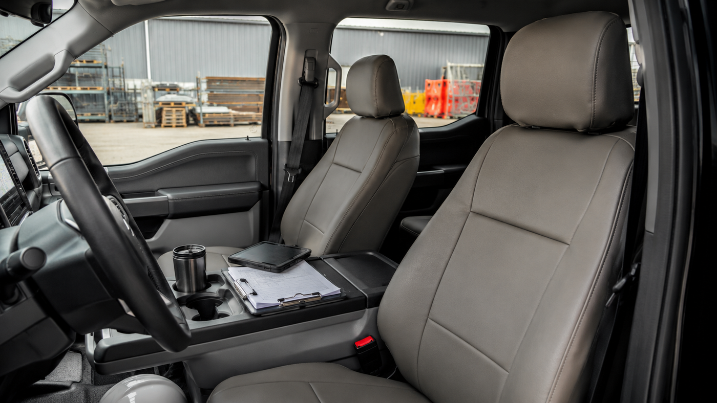 Ford F-150 Lightning Pro interior showing factory seats before adding commercial-grade protection for fleet use.