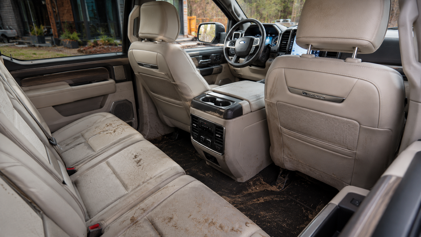 Muddy F-150 Platinum rear seats showing why premium truck interiors need protection from pets, kids, and daily mess.