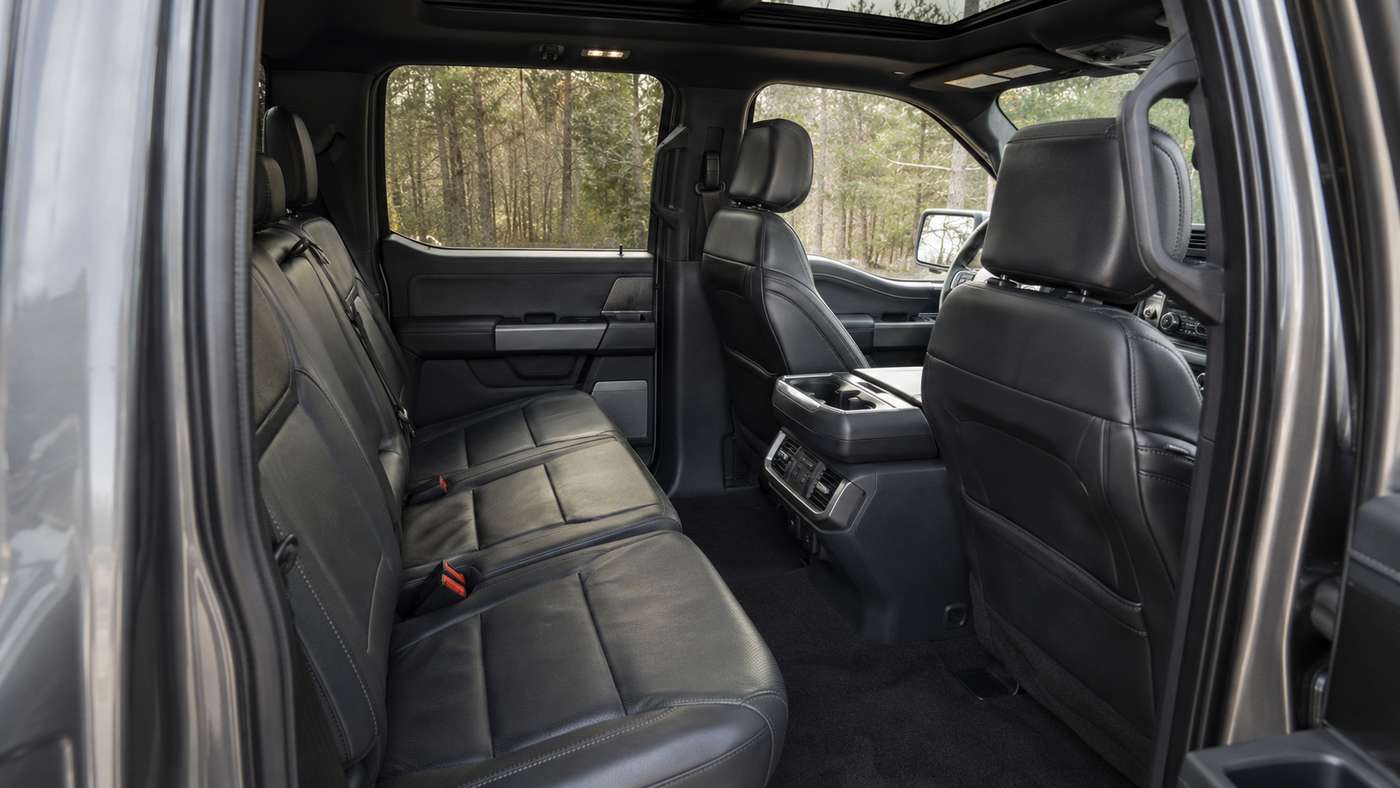 Ford F-150 Platinum SuperCrew interior after two years, showing driver seat creasing and cabin wear from daily use.