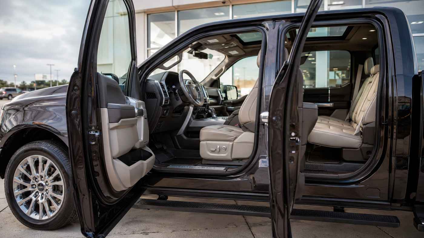 Open cabin view of a Ford F-150 Limited SuperCrew showing premium seating areas buyers should inspect before purchase.