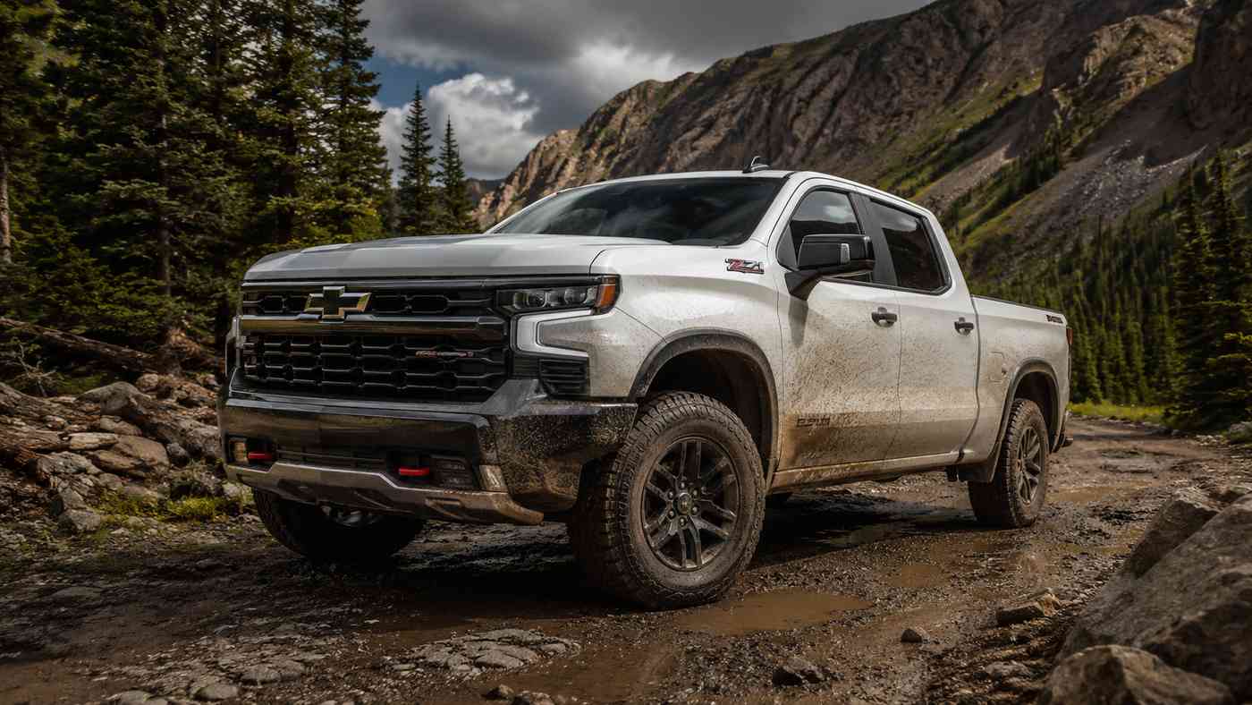 Silverado 1500 Trail Boss tackling muddy mountain trails, highlighting off-road conditions that challenge interiors.