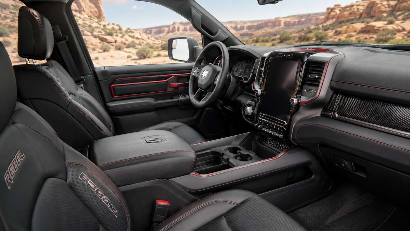 Ram 1500 Rebel interior with leather seats and cockpit, highlighting durable cabin design for daily and off-road driving.