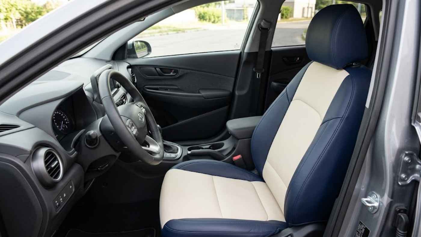 Navy and cream dual-tone eco-leather car seat covers adding custom-style contrast to a modern SUV interior with clean panel design.