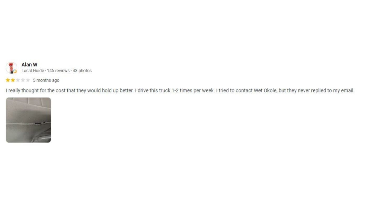 Screenshot of a customer review reporting Wet Okole seat cover durability concerns and unanswered support requests.