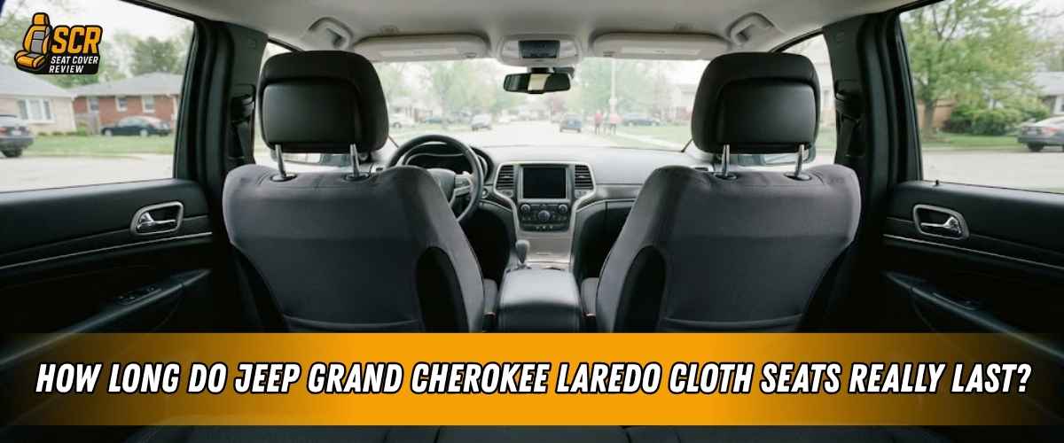 Rear cabin view of a Jeep Grand Cherokee Laredo with cloth front seats, highlighting everyday wear and stain concerns.